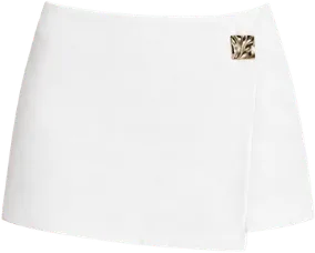 white mini wrap skirt with gold fastening skirt